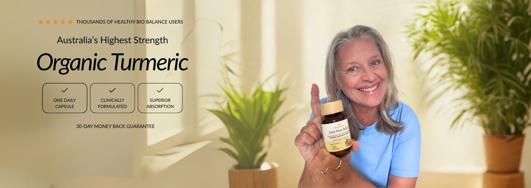 Woman holding a jar of organic turmeric with a blurred background