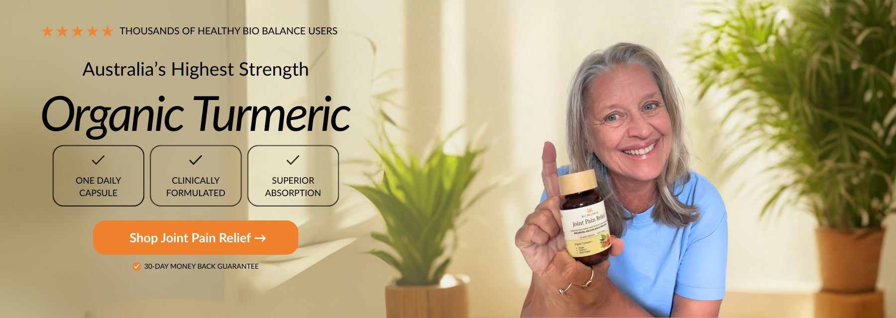 Woman holding a jar of organic turmeric with a promotional banner in the background